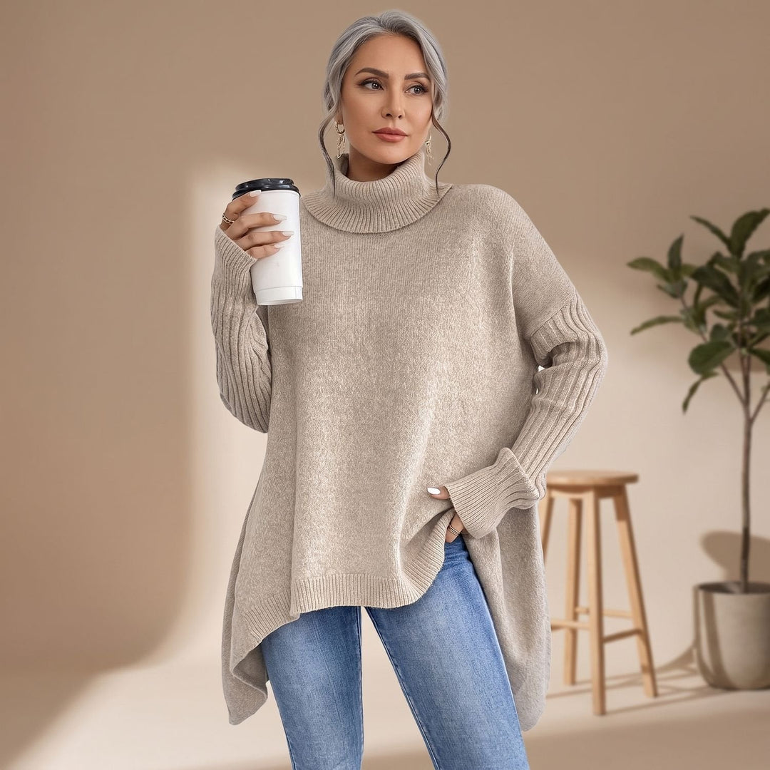 Dam oversized polotröja i kashmirstickning med långa ärmar